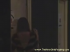 A dark-haired woman in a white blouse and black skirt comes into the stall and sits down, then a camera under the toilet looks up as she goes, with a small inset showing her from the front. Over 5 minutes.